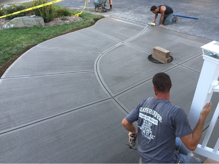 concrete contractor crew installing walkway and driveway by grasshopper concrete services the local choice for concrete companies in syracuse ny