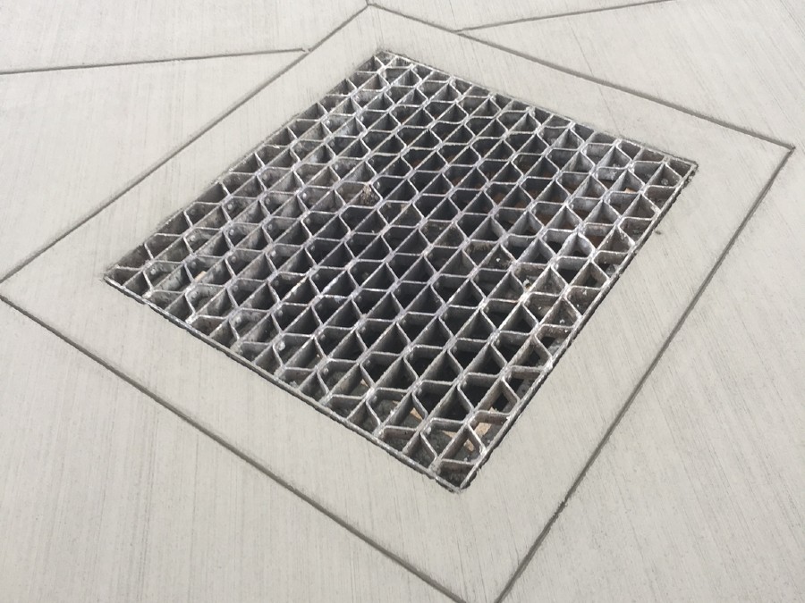 drainage contractors near syracuse ny image of storm drain repair with new concrete