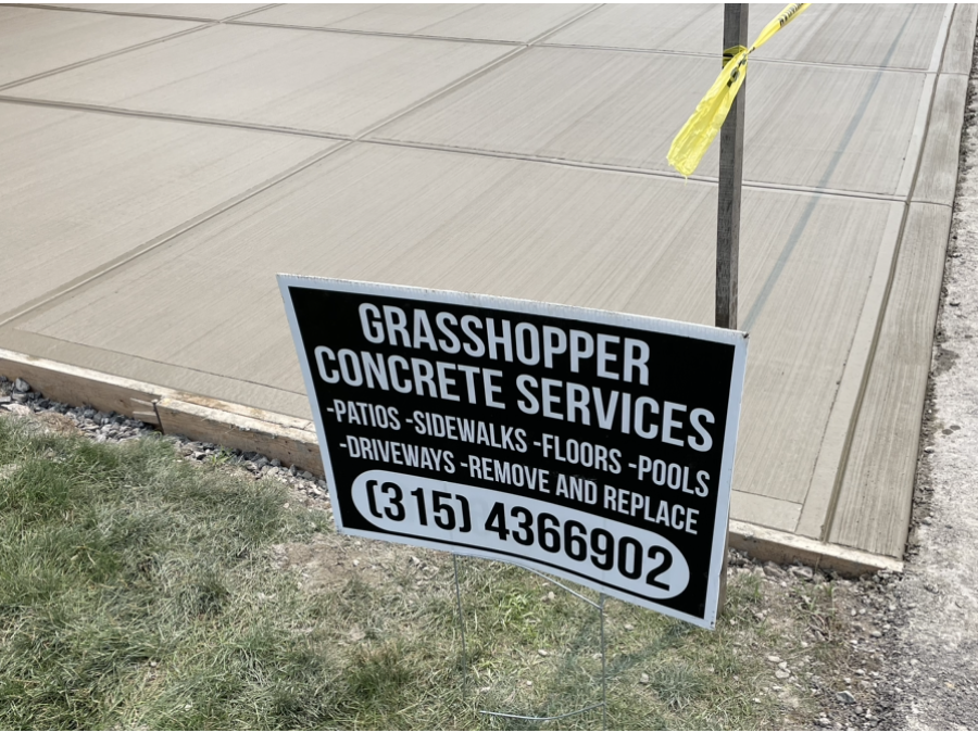 driveway contractors near syracuse ny driveway installed with sign for grasshopper concrete services patios sidewalks floors pools driveways remove and replace 315 4366902