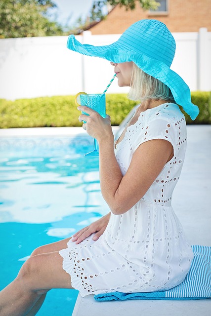 concrete pool decks near syracuse ny woman sipping drink poolside